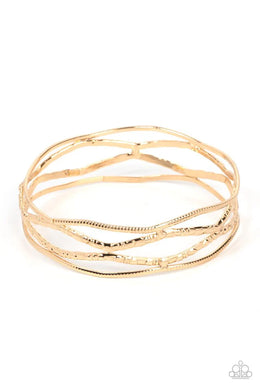 A Narrow ESCAPADE Gold Bangle